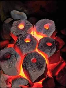 A picture of Charcoal briquettes packed in volume in 50kg bags. Available both