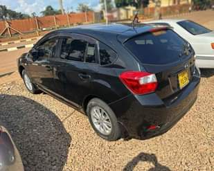 A picture of 2014 SUBARU IMPREZA FOR SALE AT UGX 28 MILLION NEGOTIABLE.