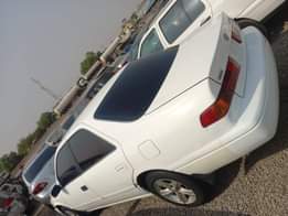 A picture of WHITE A Neatly Used Toyota Camry pencil 2002 Model With