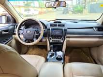 A picture of Premium Used 2014 Cream on Cream Toyota Camry LE