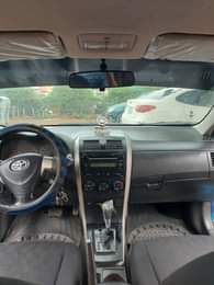 A picture of 2010 Corolla in super pristine condition repainted on first body