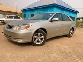 A picture of FIRST BODY UNREGISTERED UNTEMPERED ENGINE 2004 TOYOTA CAMRY IN A