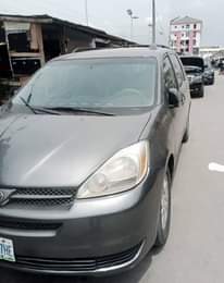 A picture of Clean Nigerian Used Grey Toyota Sienna 2005 Repainted Fabric interior