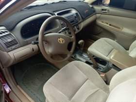 A picture of Distress distress own need money Camry 04 with good English