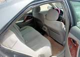 A picture of Neatly used Camry with little top noise but every other