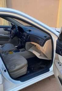 A picture of Clean Nigerian Used White Kia Optima 2009