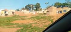 A picture of Kibiri munyonyo express way plot on quick sale