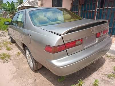 A picture of Super clean Toyota Camry 1999 Model. Tiny light 