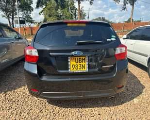 A picture of 2014 SUBARU IMPREZA FOR SALE AT UGX 28 MILLION NEGOTIABLE.