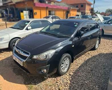 A picture of 2014 SUBARU IMPREZA FOR SALE AT UGX 28 MILLION NEGOTIABLE.