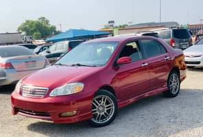 A picture of RED An Extremely Clean Used Toyota Corolla 2004 Model With