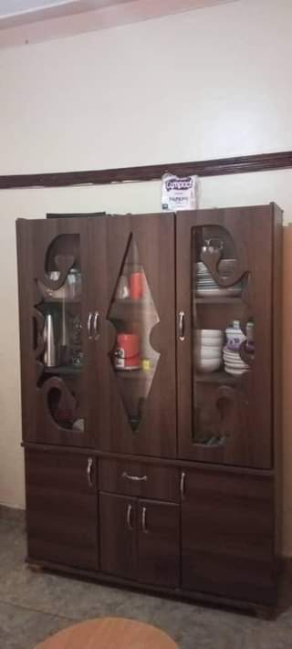 A picture of Cupboard and sofa