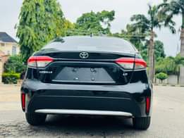 A picture of 5 months used Corolla in Abuja Price 20million only Contact