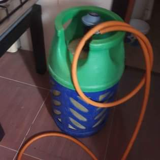 A picture of Gas cylinder with gas pipes 380.watsapp 66293656