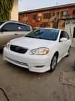 A picture of A foreign used white Corolla Sports very very clean and