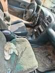 A picture of URGENT SALE Registered Mazda 323f auto drive 4lugs engine gear