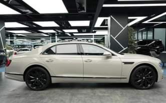 A picture of Bentley continental flying spur 2023 model hybrid Zero Km brand