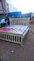 A picture of King size simple bed in natural colour