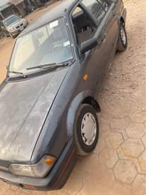 A picture of Mazda 323 available for sale in osogbo complete first body
