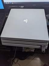 A picture of Ps4 pro 1tb pad 2 games 13