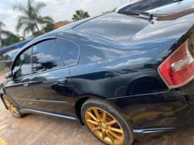 A picture of Subaru legacy turbo 2006 model UBG black color with grew