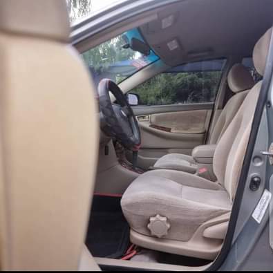 A picture of URGENTLY NEEDS MONEY CLEAN REGISTERED TOYOTA COROLLA BUY AND TRAVEL