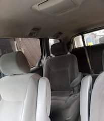 A picture of Clean Nigerian Used Grey Toyota Sienna 2005 Repainted Fabric interior