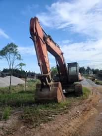 A picture of Excavator Wheel loader and hydraulic crawler drill.