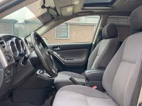 A picture of SHARP TOYOTA MATRIX 2004 MODEL HAS A PANO ROOF AT