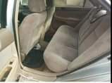 A picture of Toyota Camry 2004 4 plug Engine gear and ac are