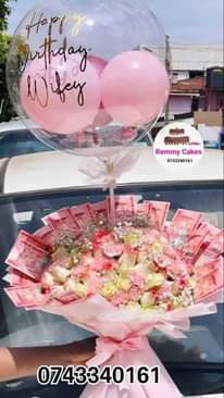 A picture of  flowerbouquet moneyhampers balloons cakes surprisepackages gifts deliveryavailable kampalaUg