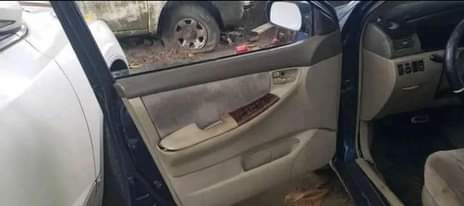 A picture of Toyota Corolla 2006 engine and gear is ok AC is