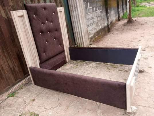 A picture of Bed frame Furniture upholstery wit brown fabric material HDF wood