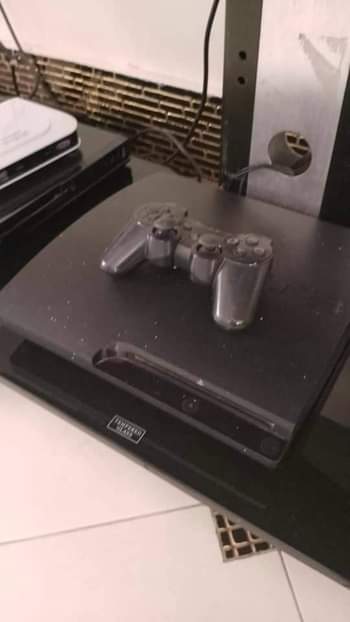 A picture of playstation 3 with 50 games cd