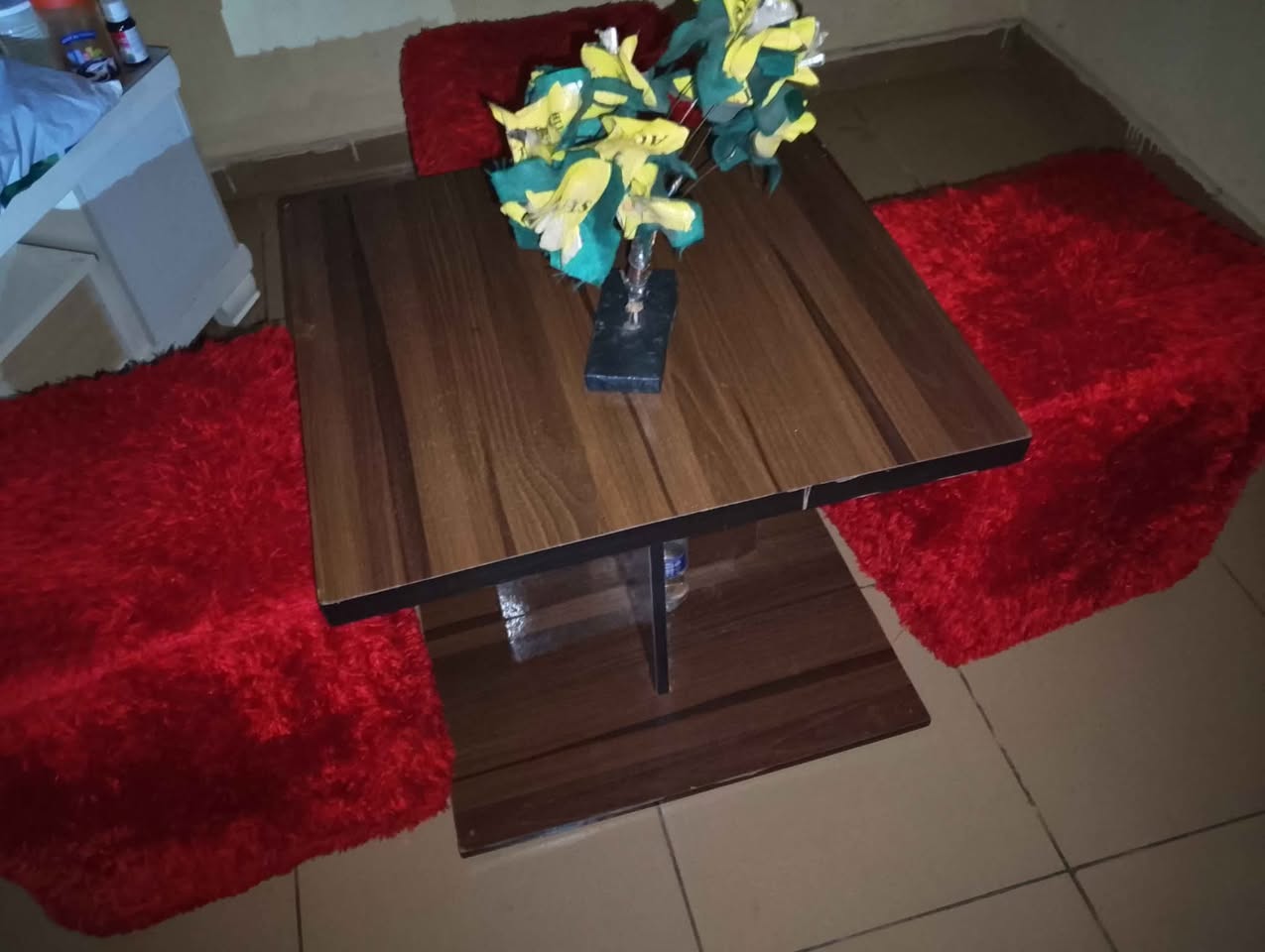 A picture of Tv stand 45k and portable dinner table and chairs 40k