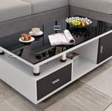 A picture of Tv show case Coffee table ukihitaji kimoja unapata