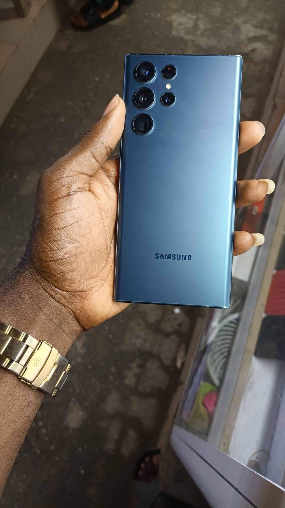 A picture of Samsung s22 ultra slight cracked screen at the top left