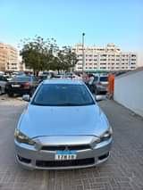 A picture of Mitsubishi lencer gcc model 2009 1 6cc no any issue