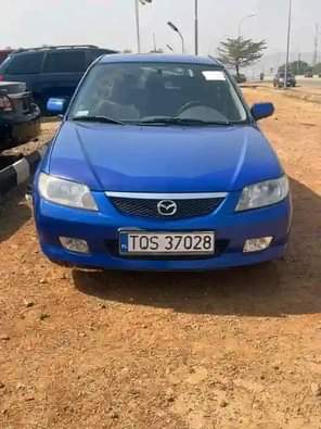 A picture of SUPER SHARP DIRECT 2002 MAZDA 323F with fully paid duty