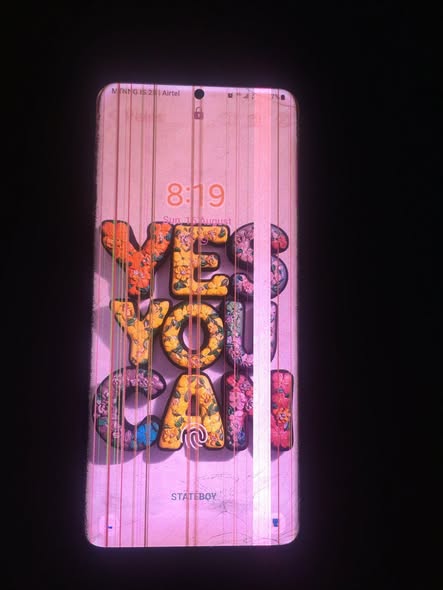 A picture of Samsung galaxy s20 plus with display lines and cracked back