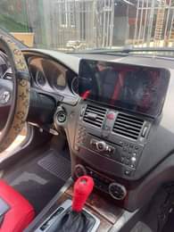 A picture of Owner is relocating he need money Urgently for this Benz