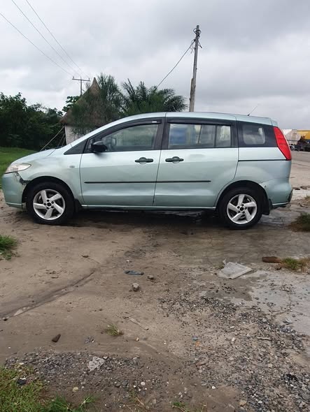 A picture of Mazda 5 3 row seat money needed algently good engine