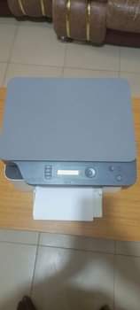 A picture of Three 3 in One Hp Laser MFP 135a printer .
