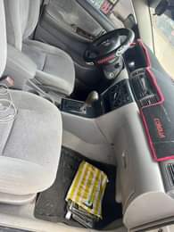 A picture of Corolla 04 everything working fine including AC Going for 3m