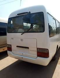A picture of Tokunbo white Toyota coaster bus for sale... diesel engine...2016 model