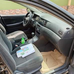 A picture of Must Go Today Sharp Black 2004 Toyota Corolla first body