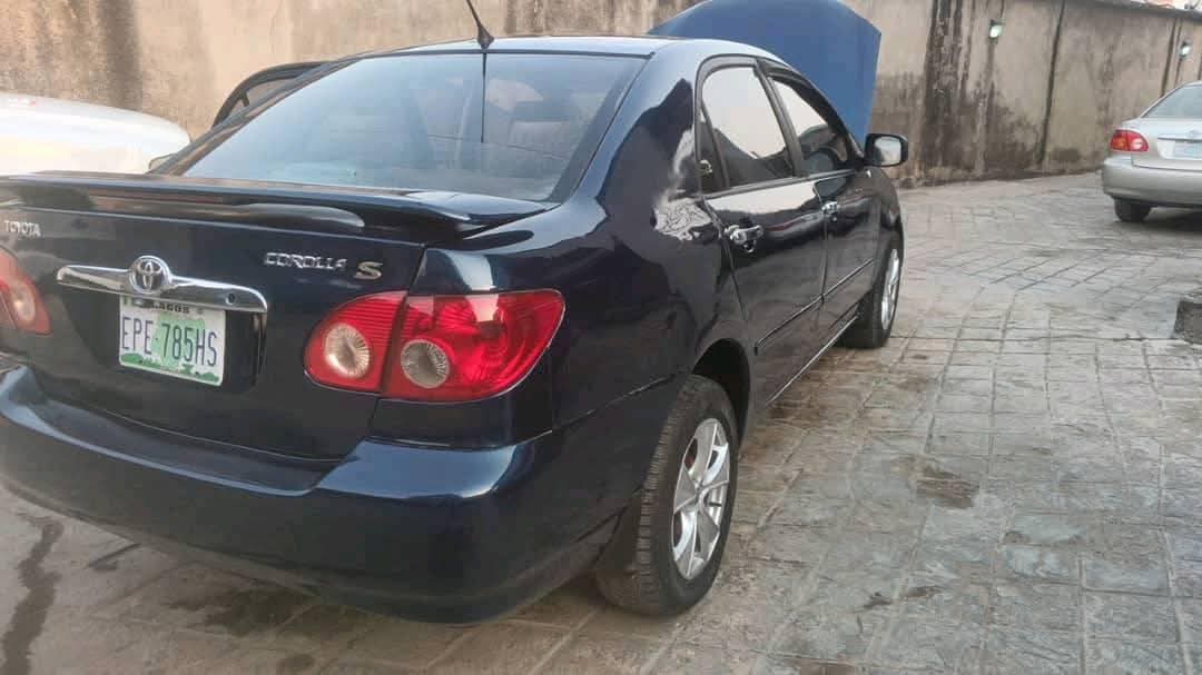 A picture of Toyota Corolla 2003. Painted. Engine gear and ac are working