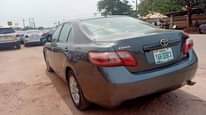 A picture of Neatly used Camry with little top noise but every other