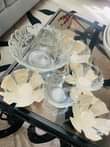 A picture of Glass vessels chairs and pasi table