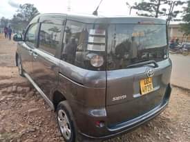 A picture of Sienta........ubj number on sale....in.... Kampala...1.5cc......18m negotiable..... silver grey colo